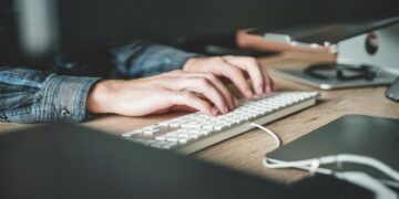 person using computer keyboard
